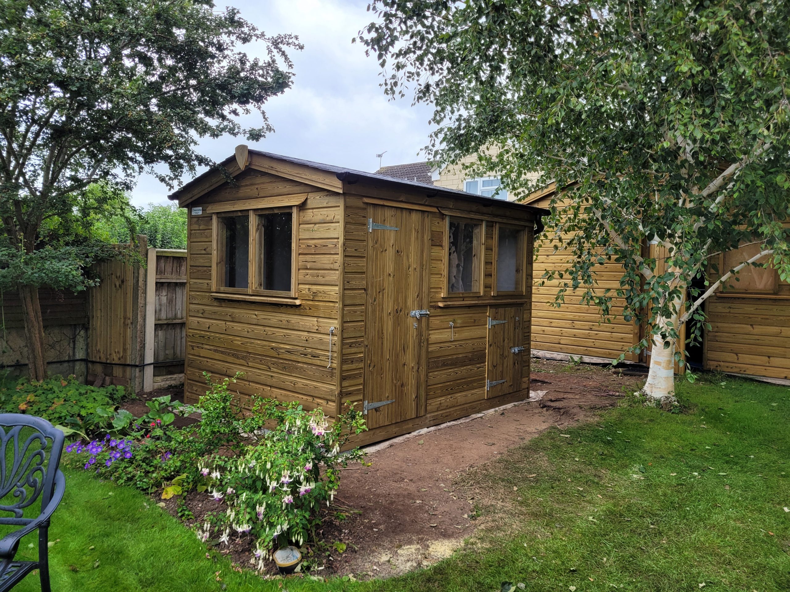 Bespoke shed with synthetic slate roof
