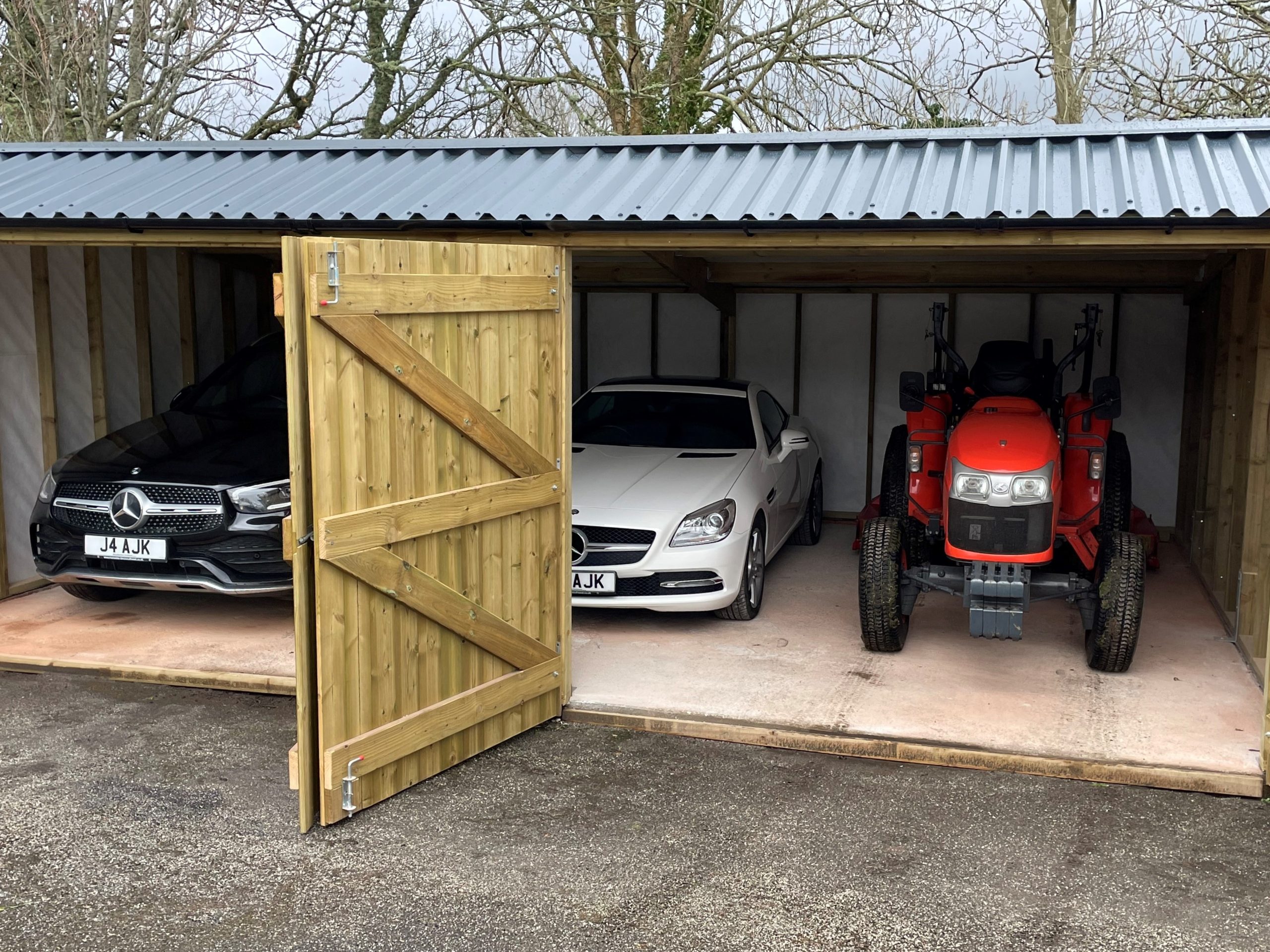 Garage housing cars ad tractor