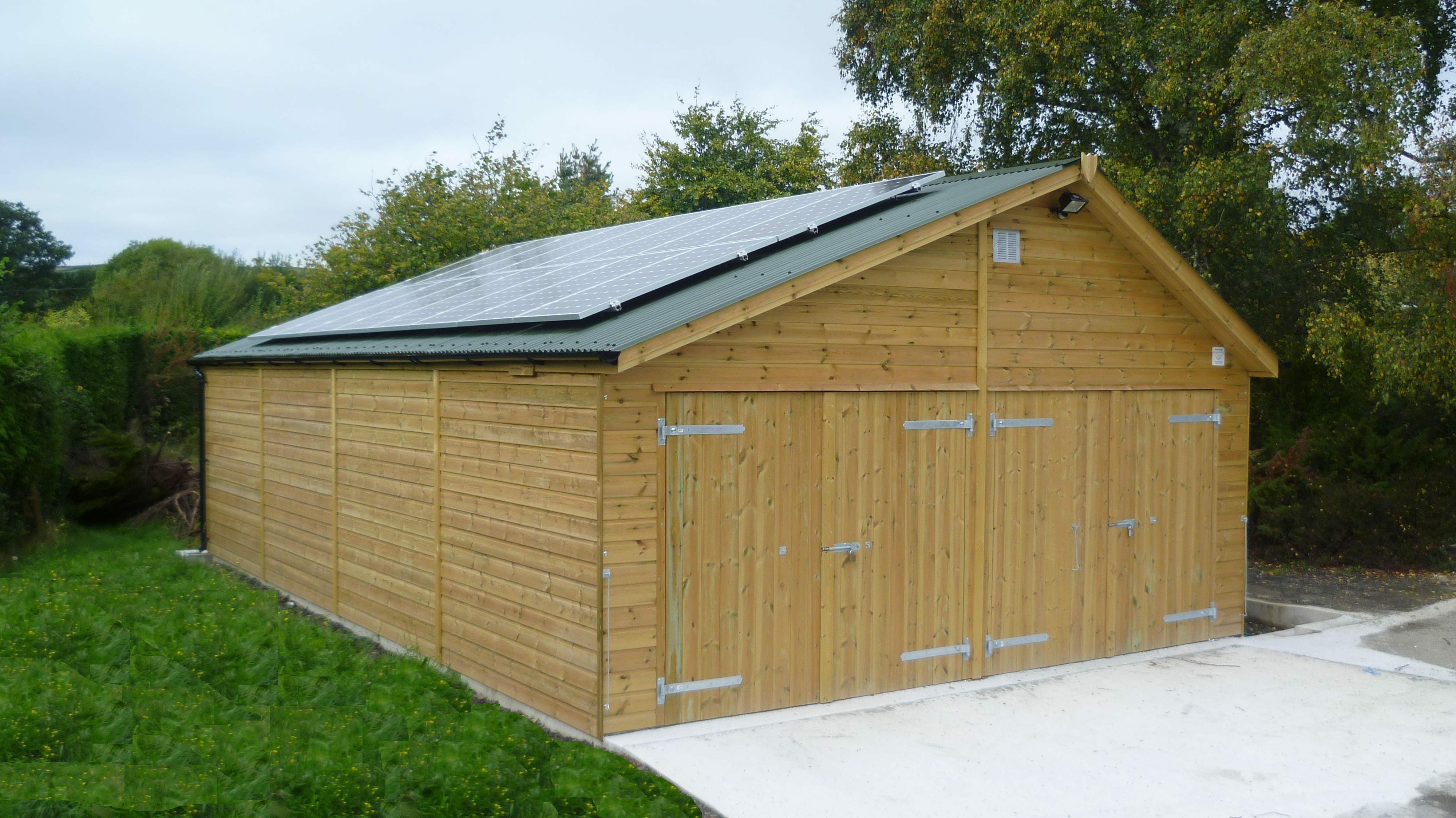 Timber clad double garage with PV roof